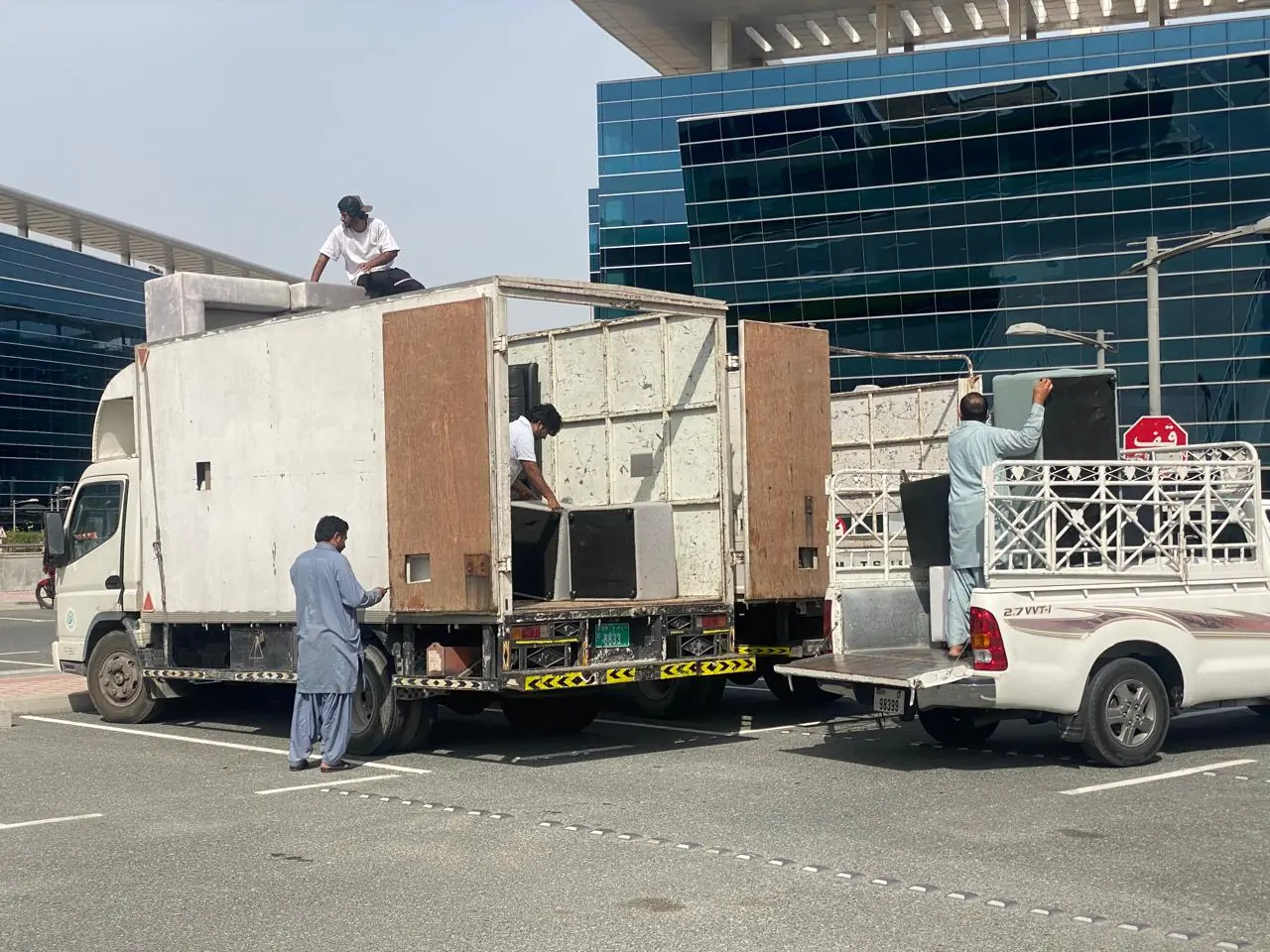 Donated furniture being loaded onto trucks in Dubai